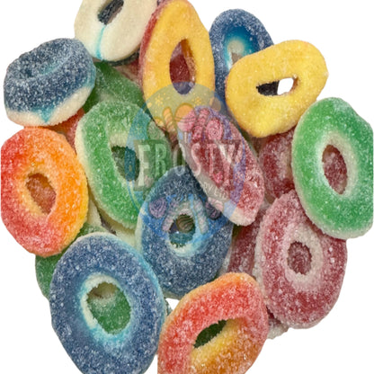 Assorted colorful gummy candy rings on a white background